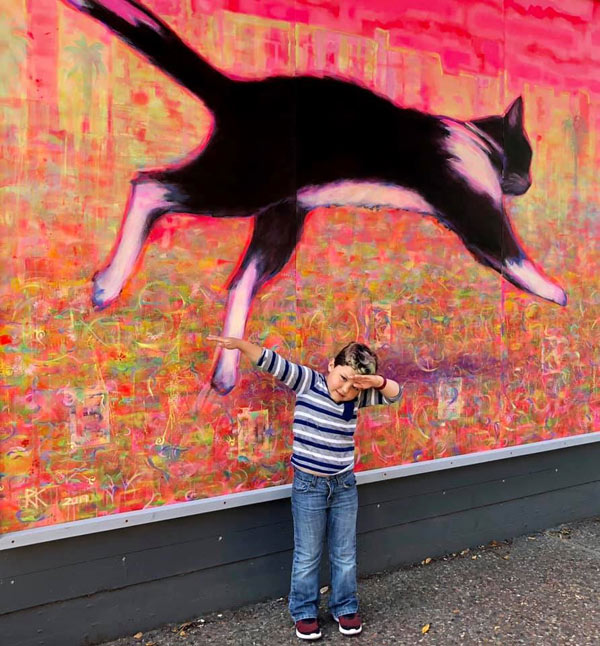 cat mural and child
