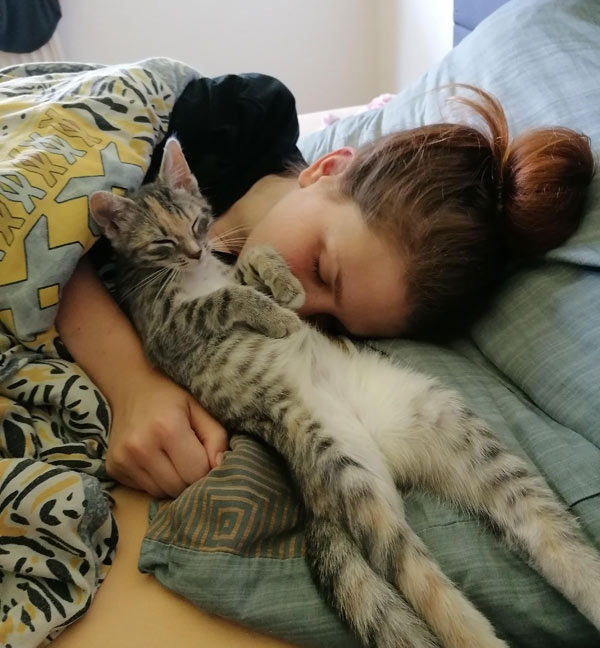girl and cat sleeping