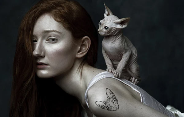 sphinx cat and owner tattoo