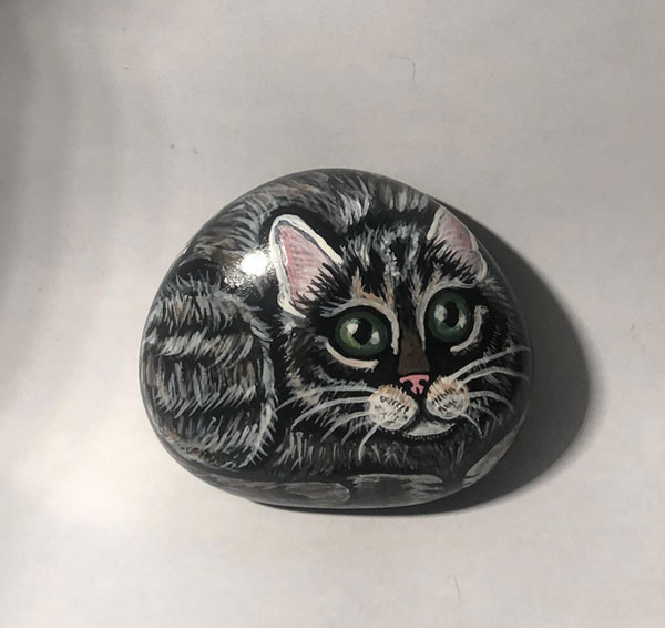 rock painted to look like cat