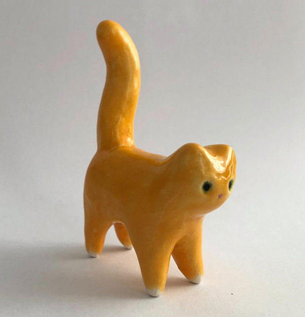 tiny ceramic yellow cat art