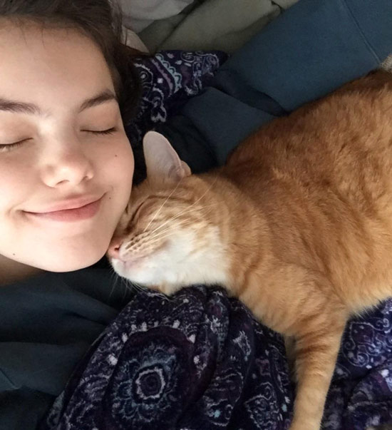 cute girl and orange cat